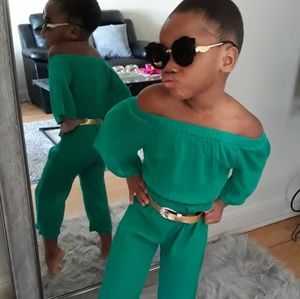 Green off the shoulder romper with gold belt